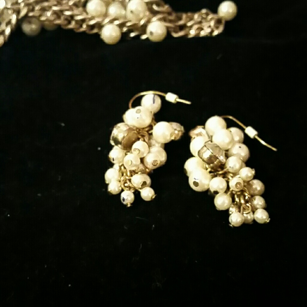 Antique gold tone earrings with pearls and rhinest